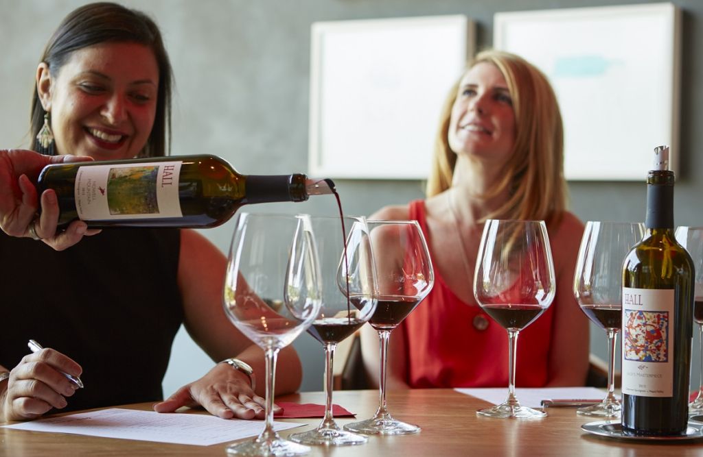 Two women enjoy a wine tasting in Napa. 