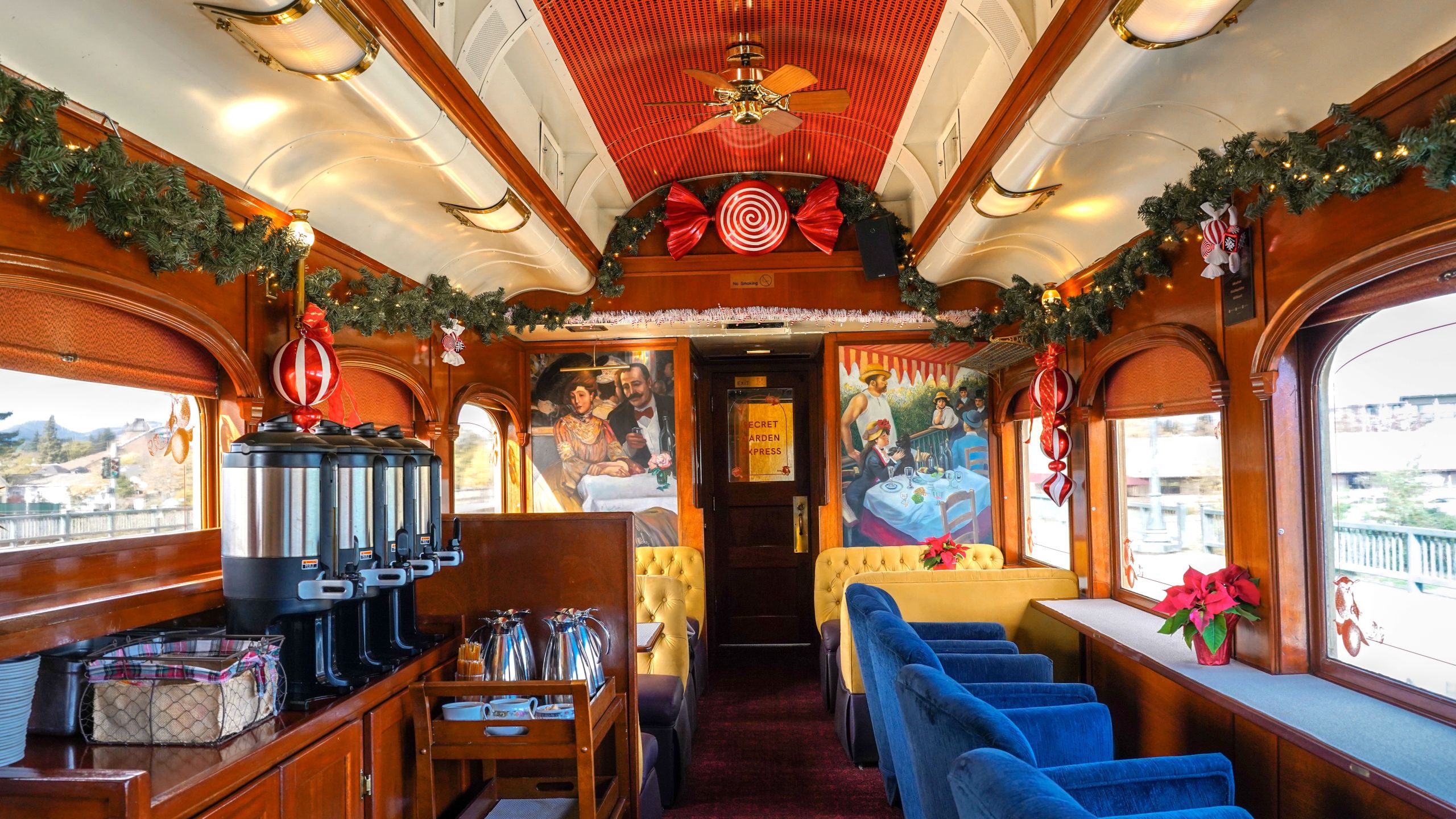 Peppermint Tea Car aboard the Napa Valley Wine Train, decorated for the holidays with festive décor and comfortable lounge seating.