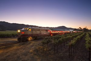 Wine Train in motion at dusk with each car lit up