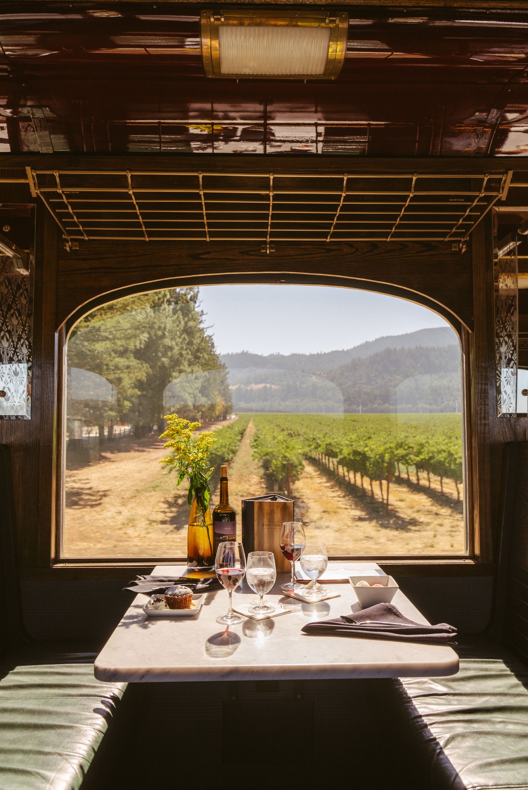 Dining car onboard the Wine Train set with food and drink
