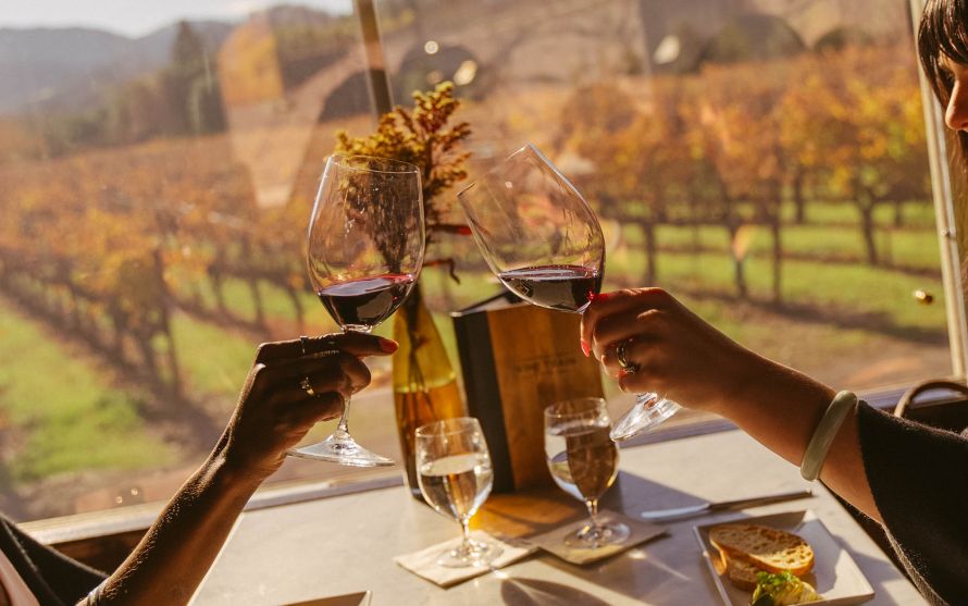two glasses clinking on train