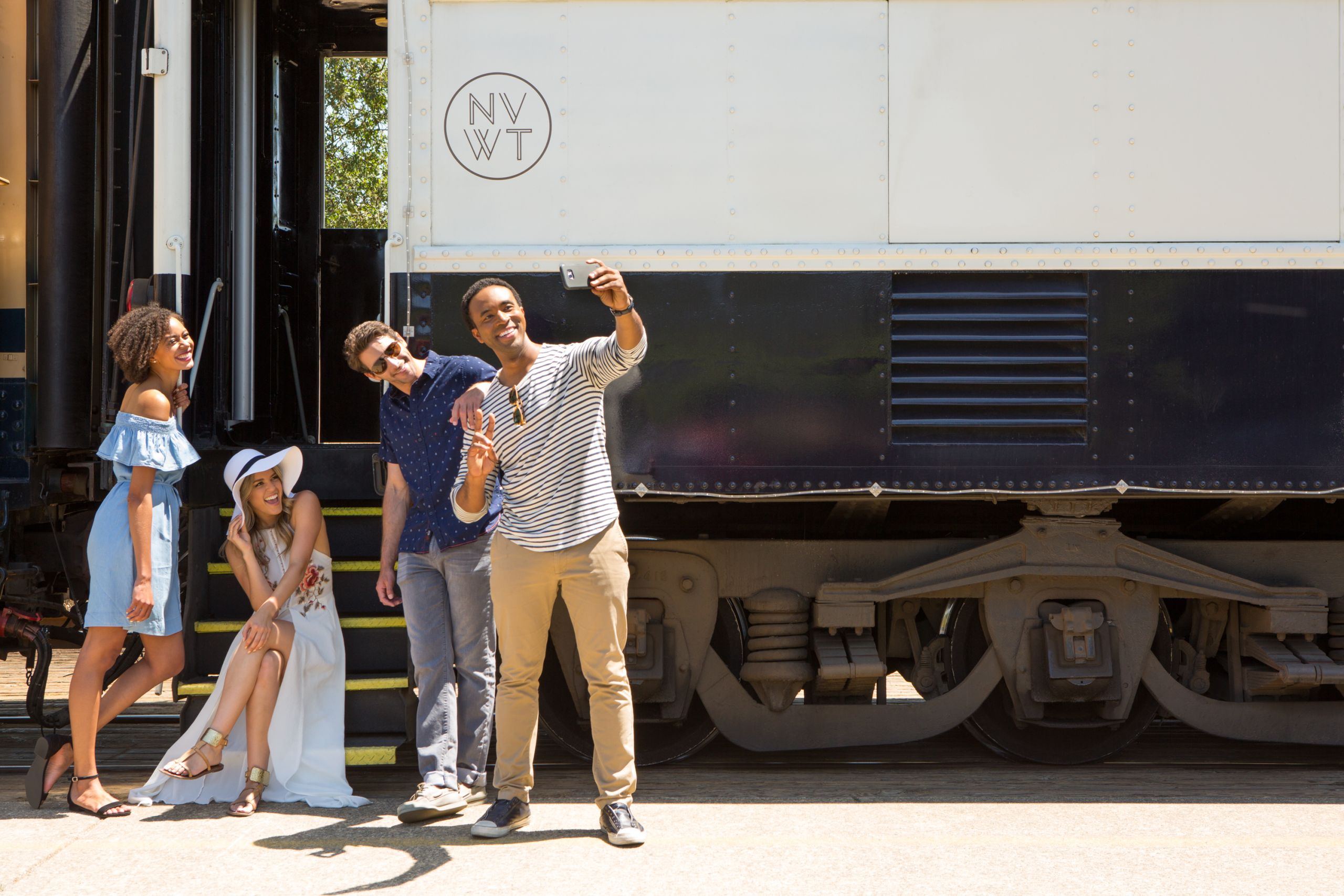 Friends pose in front of the Wine Train