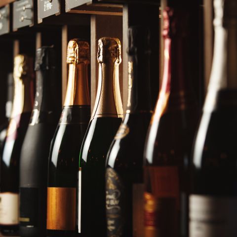 Differing wine bottles lined up in a row