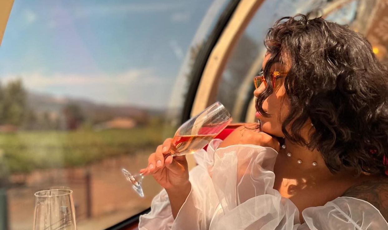 Woman takes a sip of wine