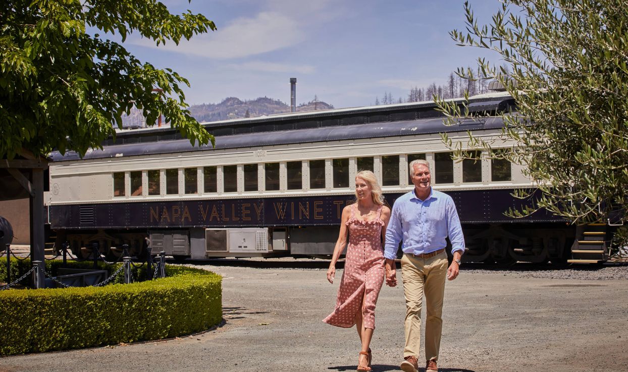 Couple hold hands while walking