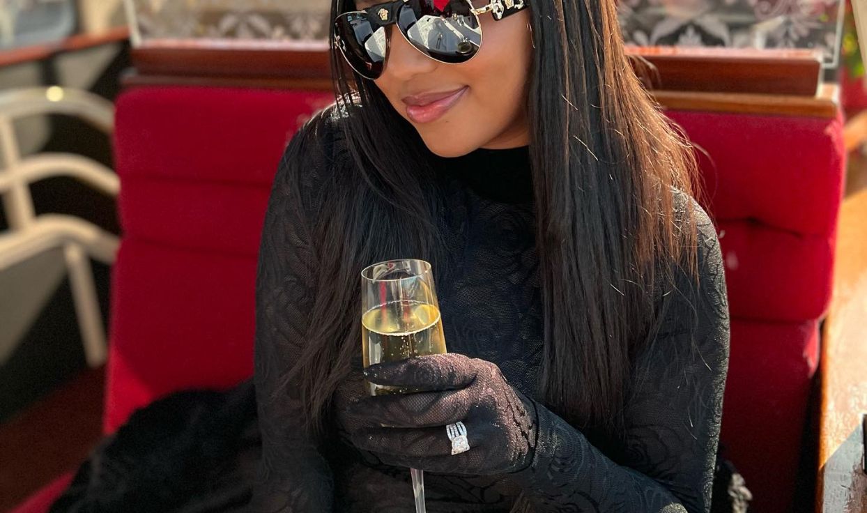 Woman poses with wine glass