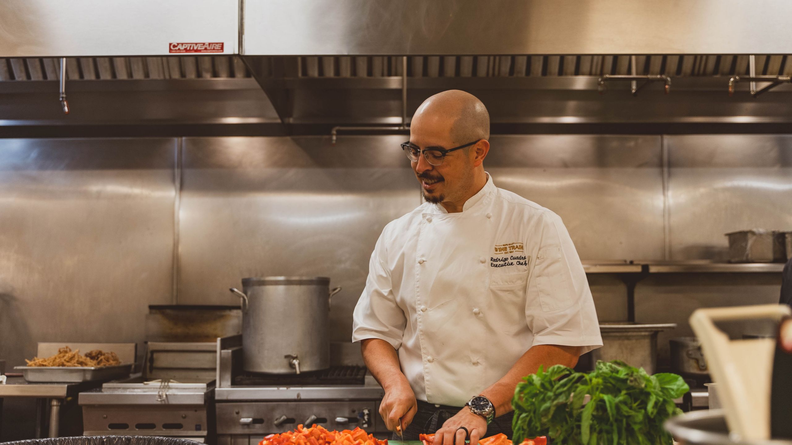 Chef dicing red peppers