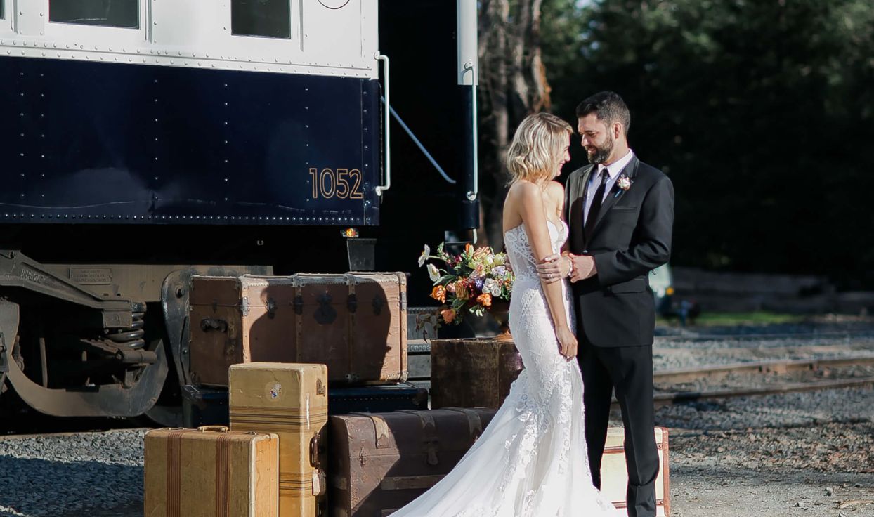 Bride and groom in front of Wine Train
