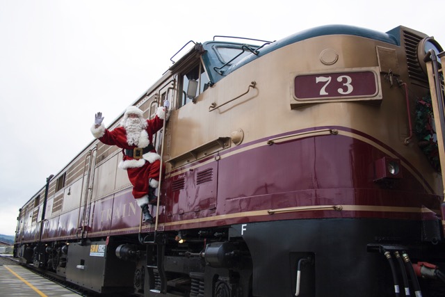 Santa waving out of train car