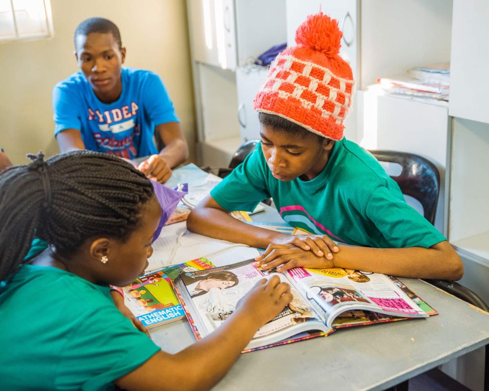 Children reading a magazine together