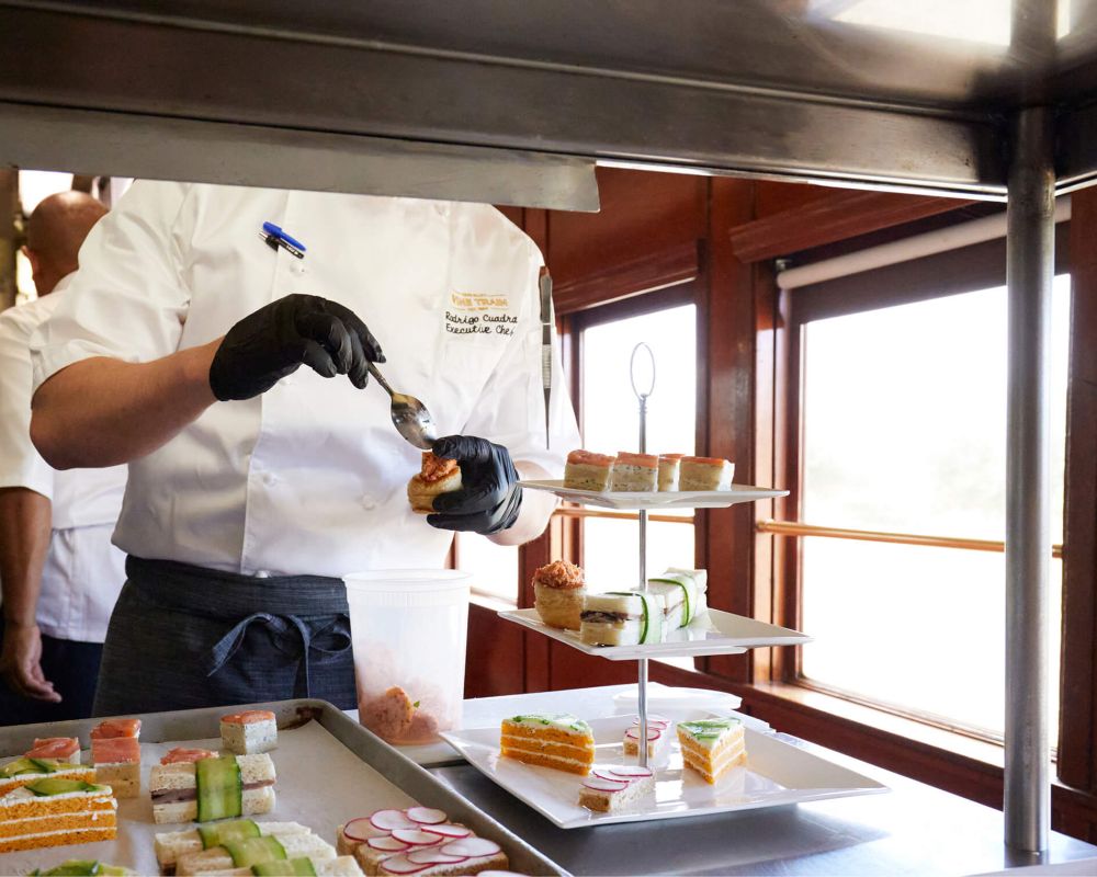 Chef prepares Afternoon tea spread