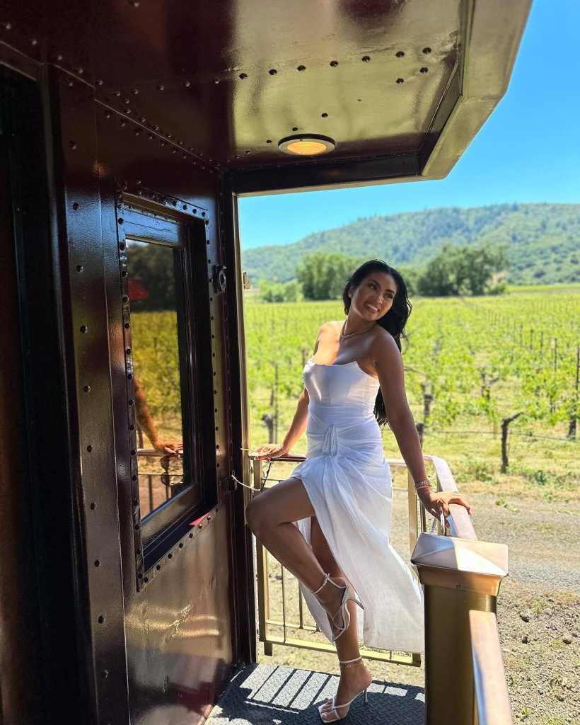 A woman poses aboard the Wine Train