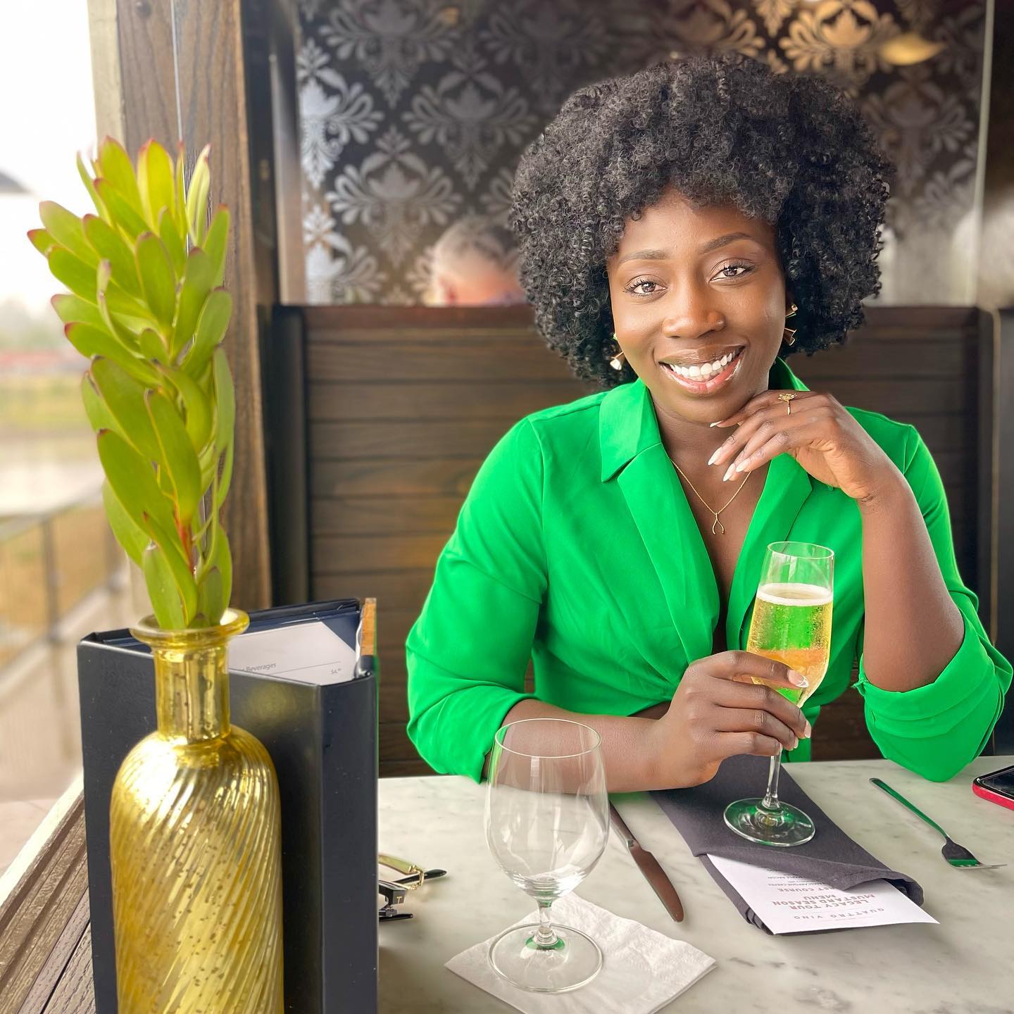 Woman posing with glass of champagne