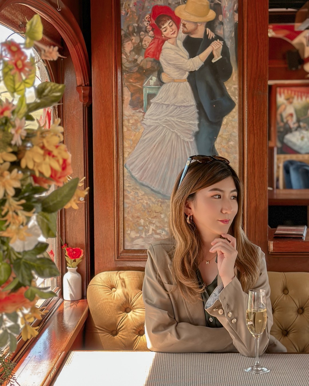 Woman with wine looks to her left