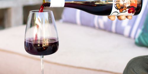 Red wine poured into a glass