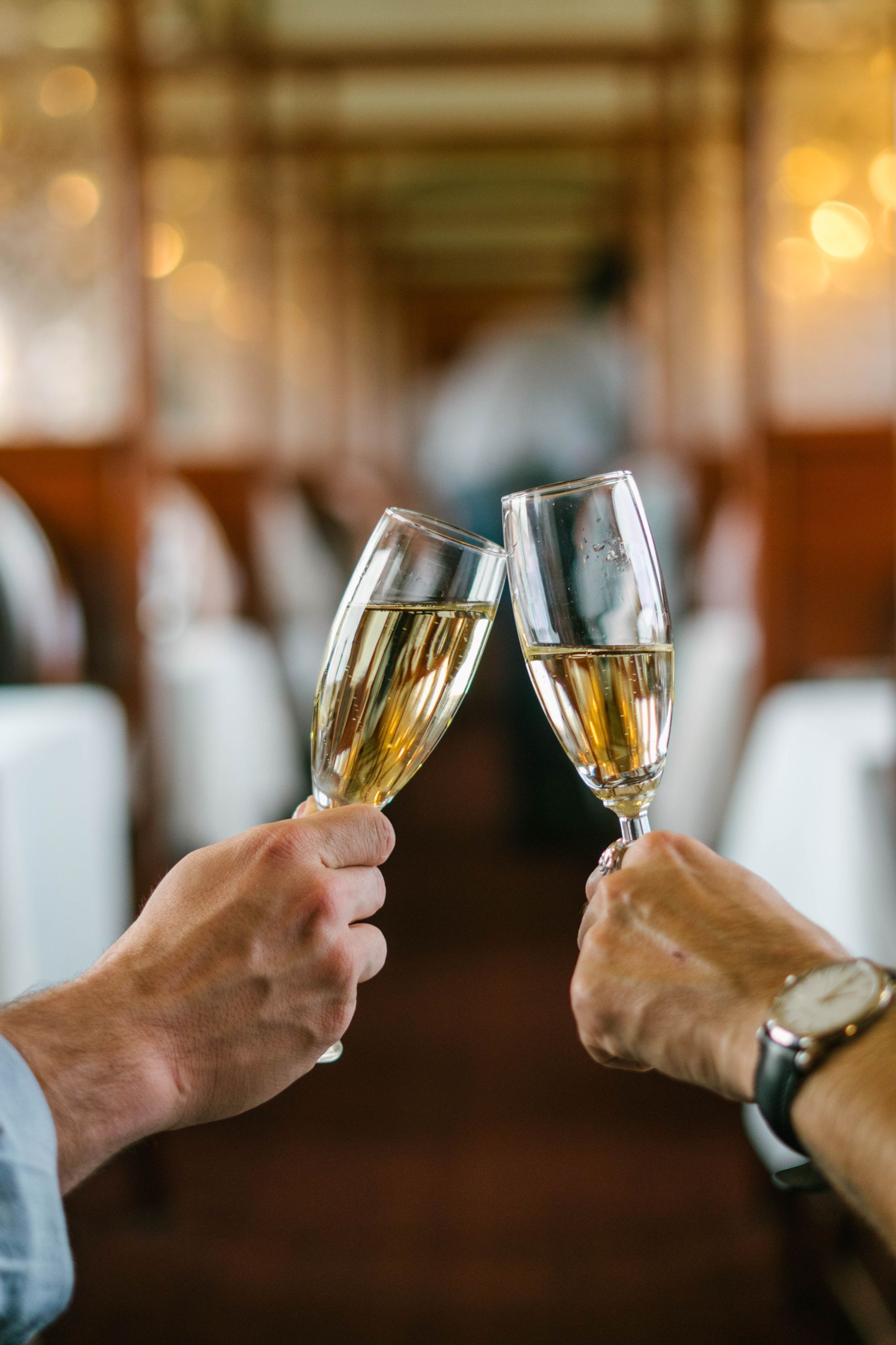 Wine glasses clinked in toast